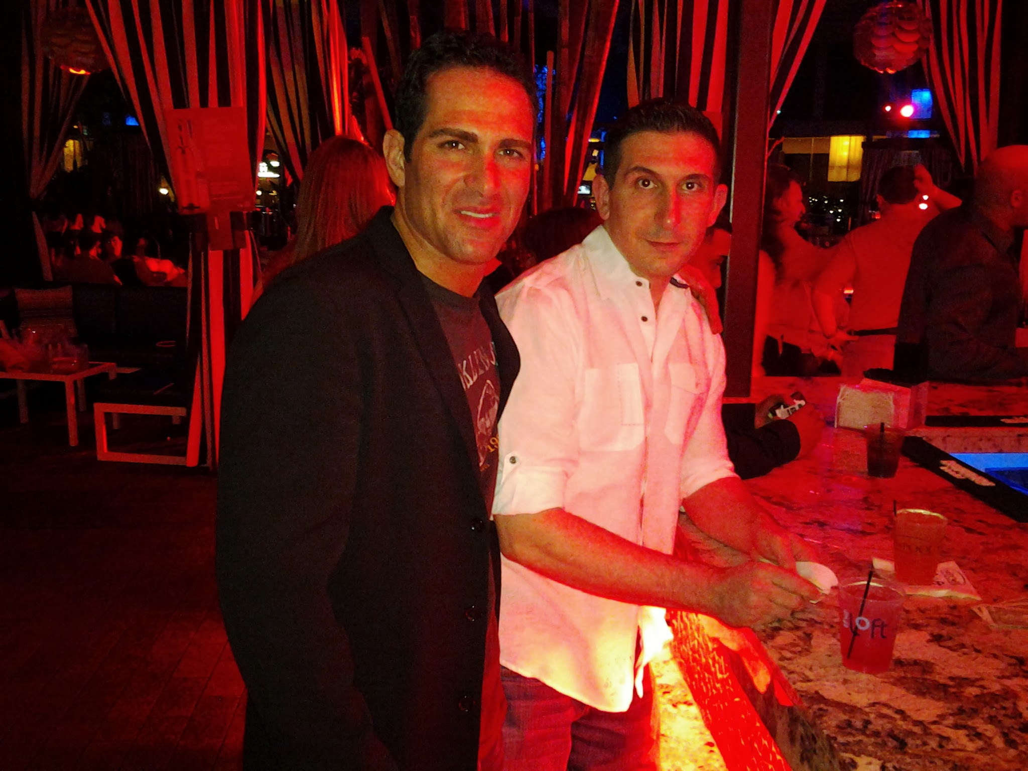 Israel Joffe photographed with a friend at a night venue in 2012